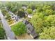 Serene aerial view of lush neighborhood, showcasing mature trees surrounding well-maintained homes at 8921 Walking Stick Trl, Raleigh, NC 27615