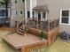 A well-maintained wood deck featuring wrought iron railings, and space for outdoor entertaining at 8921 Walking Stick Trl, Raleigh, NC 27615