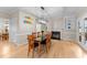 Elegant dining room with stylish lighting, fireplace and hardwood floors, perfect for entertaining at 8921 Walking Stick Trl, Raleigh, NC 27615