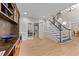 Open foyer with hardwood floors, stairway and built-in shelving for an elegant touch at 8921 Walking Stick Trl, Raleigh, NC 27615