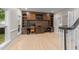 Comfortable home office featuring custom built-in shelving and ample workspace for productivity at 8921 Walking Stick Trl, Raleigh, NC 27615