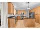 Well-lit kitchen boasts granite countertops, stainless steel appliances, and ample cabinet space at 8921 Walking Stick Trl, Raleigh, NC 27615
