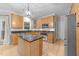 Updated kitchen showcases an island, granite countertops, stainless appliances, and stylish cabinetry at 8921 Walking Stick Trl, Raleigh, NC 27615