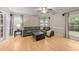 Cozy living room featuring hardwood floors, neutral paint, and plenty of natural light at 8921 Walking Stick Trl, Raleigh, NC 27615