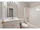 Well-lit bathroom with white cabinets, a sink, toilet, and tub/shower combo at 903 Norwood Lane Ln, Apex, NC 27502