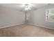 Bedroom featuring neutral carpet, a ceiling fan, and natural light at 903 Norwood Lane Ln, Apex, NC 27502