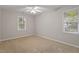 Light-filled bedroom with neutral carpet and a ceiling fan at 903 Norwood Lane Ln, Apex, NC 27502