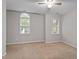 Bedroom with neutral carpet, light walls, and two windows for natural light at 903 Norwood Lane Ln, Apex, NC 27502