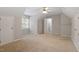 Large bedroom featuring multiple closets and doorways, with neutral colored carpet at 903 Norwood Lane Ln, Apex, NC 27502