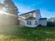 Spacious backyard featuring a well-maintained lawn and the back of the home at 91 Paige Stone Way, Angier, NC 27501