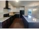 Modern kitchen featuring stainless appliances, granite countertops, and an island with sink at 91 Paige Stone Way, Angier, NC 27501
