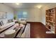 Inviting living room with modern decor, plush seating, and stylish striped rug at 91 Paige Stone Way, Angier, NC 27501