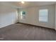 Bright primary bedroom with large windows, awaiting your personal touches and decor at 91 Paige Stone Way, Angier, NC 27501
