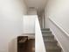 Carpeted staircase with white railing and natural light pouring in at 91 Paige Stone Way, Angier, NC 27501