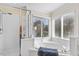 Bright bathroom featuring a glass-enclosed shower and soaking tub with lots of natural light at 9204 Cub Trl, Raleigh, NC 27615