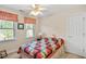 Comfortable bedroom featuring a colorful quilt, natural light, and standard closet at 9204 Cub Trl, Raleigh, NC 27615