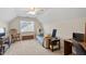 Spacious bedroom featuring a comfortable seating area, desk, and lots of natural light at 9204 Cub Trl, Raleigh, NC 27615