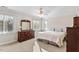 Bright bedroom featuring a large bed, dresser with mirror, and natural light at 9204 Cub Trl, Raleigh, NC 27615