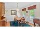 Traditional dining room featuring hardwood floors, elegant wainscoting, and a classic chandelier at 9204 Cub Trl, Raleigh, NC 27615