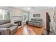 Comfortable living room with a fireplace, hardwood floors, and plenty of natural light at 9204 Cub Trl, Raleigh, NC 27615
