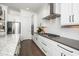 Bright kitchen showcases stainless appliances, shaker cabinets, subway tile backsplash, and granite countertops at 936 Regency Cottage Pl, Cary, NC 27518