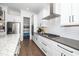 Bright kitchen showcases stainless appliances, shaker cabinets, subway tile backsplash, and granite countertops at 936 Regency Cottage Pl, Cary, NC 27518