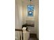 Second floor landing showcasing a decorative light fixture and a modern painting at 936 Regency Cottage Pl, Cary, NC 27518