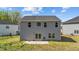 View of the back exterior with a patio and sliding glass door at 95 Shady Creek Trl, Garner, NC 27529