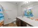 Bathroom featuring single sink, tile flooring, and decorated mirror at 95 Shady Creek Trl, Garner, NC 27529