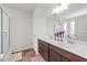 Bathroom with double vanity, mirror, cabinet storage, shower, and tile flooring at 95 Shady Creek Trl, Garner, NC 27529