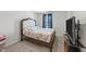 Comfortable bedroom with plush queen bed, carpet, dark curtains, and tv at 95 Shady Creek Trl, Garner, NC 27529