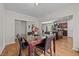 Dining area showcases a table with marble top and dark chairs, with view to living areas at 95 Shady Creek Trl, Garner, NC 27529