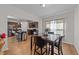 Dining area showcasing table with marble top and dark chairs, with view to the kitchen at 95 Shady Creek Trl, Garner, NC 27529
