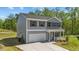Charming two-story home with gray siding, black shutters, and a well-manicured front lawn at 95 Shady Creek Trl, Garner, NC 27529