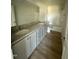 Bathroom featuring double sink vanity, granite countertop, and tub shower combo at 99 Pate Landing Dr, Selma, NC 27576