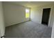 Bright bedroom features neutral paint, plush carpeting and a window for natural light at 99 Pate Landing Dr, Selma, NC 27576