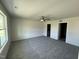 Spacious bedroom with ceiling fan, new carpet, and ample natural light at 99 Pate Landing Dr, Selma, NC 27576