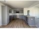Modern kitchen featuring gray cabinets, granite counters, and stainless microwave at 99 Pate Landing Dr, Selma, NC 27576