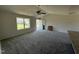 Bright living room with new carpet, vaulted ceiling, and a view to the front entrance at 99 Pate Landing Dr, Selma, NC 27576