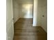 Walk-in closet featuring laminate floors and wire shelving for storage at 99 Pate Landing Dr, Selma, NC 27576