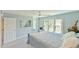 Comfortable bedroom with blue walls, large window, and ceiling fan at 104 Buckeye Ln, Chapel Hill, NC 27516