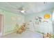 room with playful wall art, ceiling fan, and a rocking chair at 104 Buckeye Ln, Chapel Hill, NC 27516