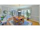 Bright dining room with wood table, blue rug and view of staircase at 104 Buckeye Ln, Chapel Hill, NC 27516