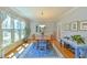 Dining room features hardwood floors, large window, and traditional furniture at 104 Buckeye Ln, Chapel Hill, NC 27516