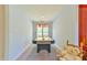 Bright game room featuring an air hockey table, plush carpet, and a window with colorful accents at 104 Buckeye Ln, Chapel Hill, NC 27516