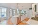 Kitchen with stainless steel appliances, island with sink, and hardwood floors at 104 Buckeye Ln, Chapel Hill, NC 27516