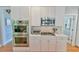 Bright kitchen features stainless steel appliances, white cabinetry, and a gas range at 104 Buckeye Ln, Chapel Hill, NC 27516