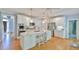 Updated kitchen features a large center island, stainless appliances, and modern lighting at 104 Buckeye Ln, Chapel Hill, NC 27516