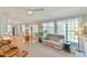 Relaxing living room with large windows, comfortable seating, and views to the breakfast nook at 104 Buckeye Ln, Chapel Hill, NC 27516