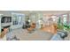 Open-concept living room with access to the kitchen, desk area, and outdoor patio at 104 Buckeye Ln, Chapel Hill, NC 27516